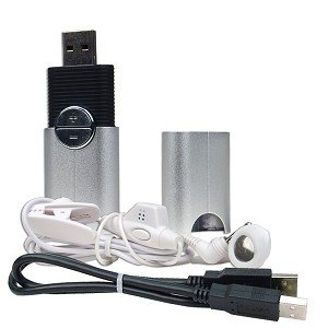 Small device in the shape of a flash drive with a lid, accompanying in-ear headphones, and usb cable.
