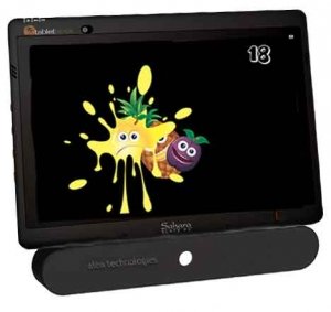 Tablet with an oblong, eye-gaze camera mounted to the bottom. On the screen is a bright splash of yellow color with eyes and a mouth, followed by pineapple and plum.