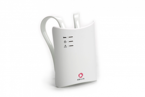 A white rectangular device menu options on the front, an antenna on the top, and hook on the back.