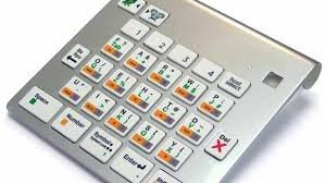 27 key mini-keyboard that sits on a slant. It is silver with 6 rows of multi-task keys; there is a small power light on the top right.