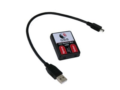 A small, black switch box with accompanying usb cable has with two input ports, one for space and one for enter. 