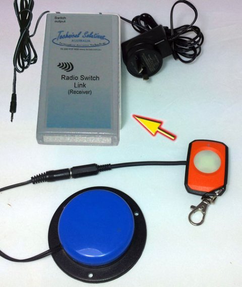 Rectangular, handheld device with wall charger can be connected to a switch button at bottom, right.  