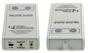 Rectangular unit with control buttons on top, light on top edge, and switch inputs along bottom edge.