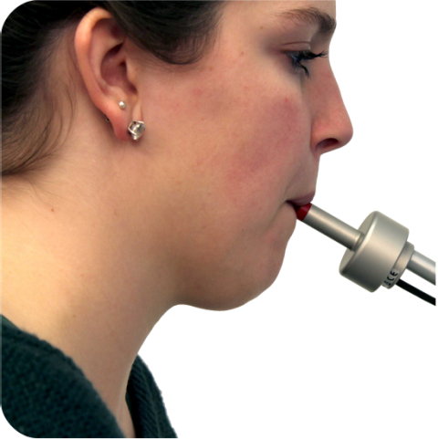 A woman use The Lipstick in use by blowing into it.