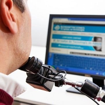 Man using Bj Chin with a mounting arm.