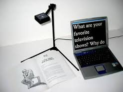 Kurzweil 1000 Reading Software on a laptop displaying text that is under a document camera. The text is magnified and shown on the computer screen.