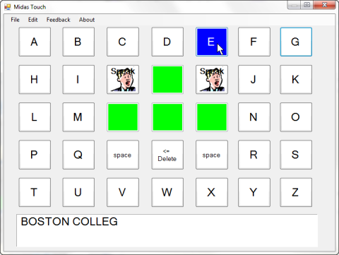 On-screen keyboard arranged by alphabet with 9 function keys in the middle. Two of these keys have a picture of a man with the word "speak", and 4 keys are bright green. The mouse is pointing at a blue key and the bar at the bottom shows the text that is being written.
