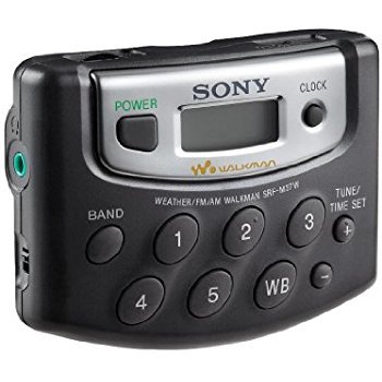 View of five present buttons, power button, tuning button, clock display and side inputs.