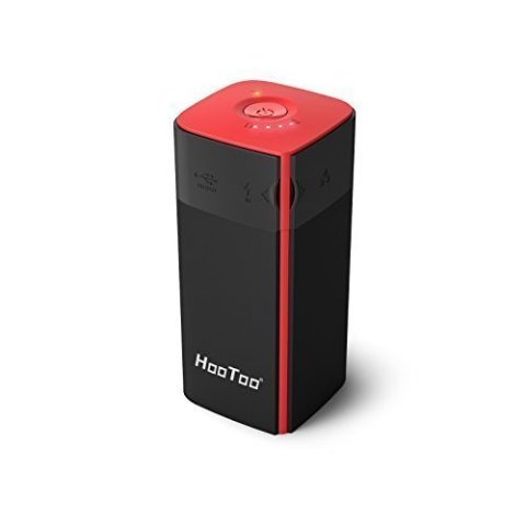 High angle view of a black and red device that looks like a wireless speaker.