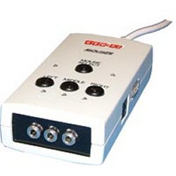 Small, white rectangular plastic device with mini-jack and PS2 input ports.