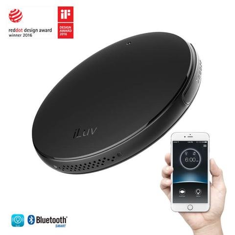 Round, flat device and smartphone with alarm time screen.