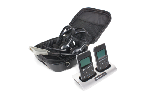 a pair of devices that are mounted on a holder. It comes with a pair of microphones in a black pouch.