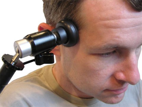 Head pressed against switch attached to mounting device.
