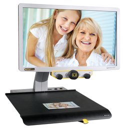 Screen magnifier camera mounted on bottom of monitor on a flat mount.
