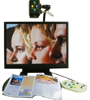 Monitor with magnifier mounted at the top with controls to zoom and a light attached.