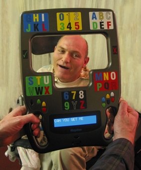 Person holding MegaBee with another person's head positioned inside the frame.