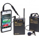 Wireless Audio System consisting of a transmitter, receiver, and a clip on lapel mic. An iPhone is connected by cable to the receiver.