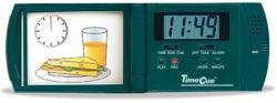 Long, green, horizontal pocket device with display on left showing a meal and a clock, and digital clock and control buttons on right.