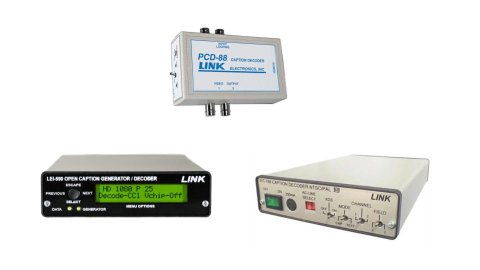 Two different models of caption decoders. One model resembles a black DVD player with an LCD panel; another is a smaller, light grey box with no display. This model has a white label that reads "PowerLink."  A third product resembles a white DVD player with no LCD display and various input jacks.
