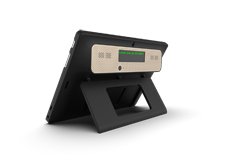 Rear view of tablet computer propped up by a stand and revealing a small display screen on the back.