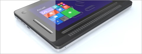 Angled view of black rectangular tablet computer showing front left corner and colorful grid on the screen.
