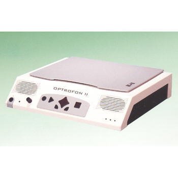 White scanning device with a slanted front which has 2 speakers on each end and large black buttons in the middle: the largest is diamond shaped with a standard "record" circle and "play" triangle on one side and a "stop" square on the other. The lower part of the diamond button also has 2 more small buttons. The scanner bed has a cover that is closed.