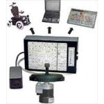 Wergen Mouse control device shown with a keyboard, laptop and wheelchair.