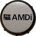 A gray, circular device with a black base.