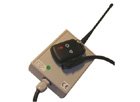 A beige rectangular device with an antenna and a cord and a small black remote with buttons.