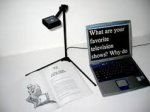 Kurzweil 1000 Reading Software on a laptop displaying text that is under a document camera. The text is magnified and shown on the computer screen.