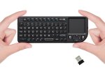 A small black keyboard with a touchpad to the right.