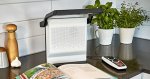 Small, rectangular speaker and document reader. 