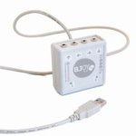 White usb connector and four switch imports on a white rectangular device.