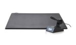 Black rectangular pad next to a small microphone on a stand