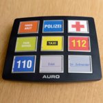 Square device with nine quick dial buttons.