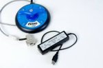 Round device with joystick and connector, separate mouse interface device.