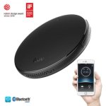 Round, flat device and smartphone with alarm time screen.