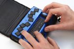 Small blue braille keypad.