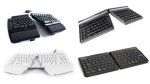 Various models of ergonomic split keyboards. These keyboards resemble standard models, except that they are split down the middle into two separate modules. Two models feature the modules connected close together but angled upwards and outwards. One device has the two modules connected, so that the device is essentially a standard keyboard. The fourth device has its two components separated wider apart. Three keyboards are black; the fourth is solid white. All devices have keys in contrasting colors.