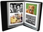 Open photo album with two images per page on either side.