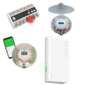Four different pill dispensers, including one round one with a smartphone next to it.
