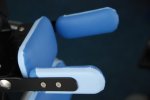 Blue headrest with 2 blue padded side flaps on either side.
