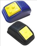 Two medium-sized curved, rectangular devices. Each has a flat, yellow, and textured square on top that the user presses to activate the device.