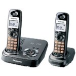 Two cordless telephones standing on black platform bases.