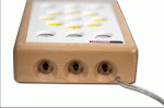 Front view of mustard yellow small rectangular device with smaller buttons, yellow buttons with arrows arranged in a circle and additional controls along the top and bottom.