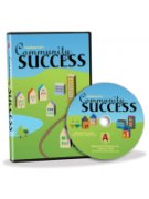 A CD and matching case, each with a blue and green town scene featuring houses and buildings.
