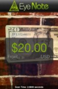 A captured image of a 20$ US bill, with a dialogue box overlaid on top reading "$20.00, Front, USD," in bright green font. At the top of the screen is the EyeNote logo, which features the "eye pyramid" graphic that is printed on US paper currency. 